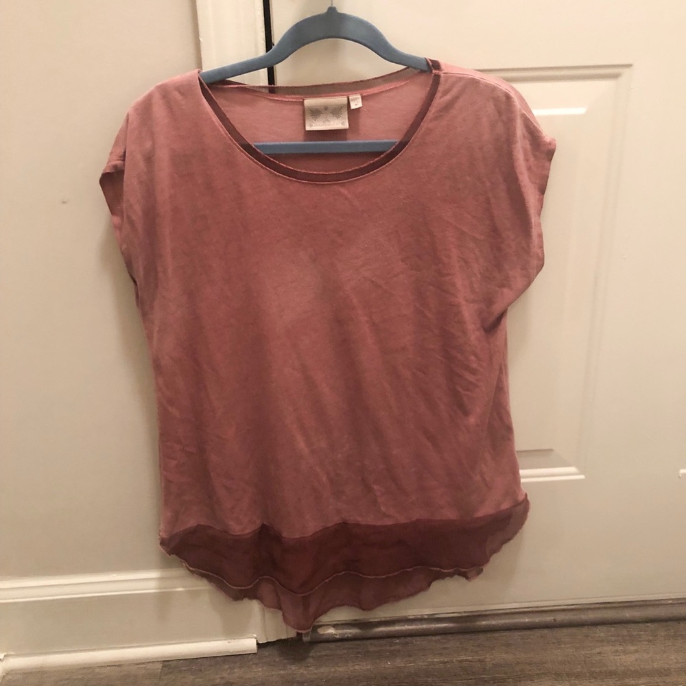 Medium distressed/faded dusty rose shirt.